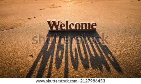 Welcome board on the beach at sunset, Outdoor or travel background