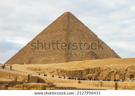 The Great Pyramid Khufu (or Pyramid of Cheops) is the oldest and largest of the three pyramids in the Giza pyramid complex, the oldest of the Seven Wonders of the Ancient. Cairo, Egypt Royalty-Free Stock Photo #2127996431