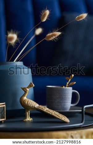 Creative composition of glamour living room interior design with home decoration, vase with dried flower and personal accessories. Close up. Template. Royalty-Free Stock Photo #2127998816