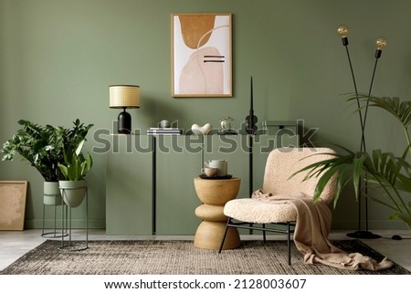 Elegant living room interior design with mockup poster frame, modern frotte armchair, wooden commode and stylish accessories. Green eucalyptus wall. Template. Copy space.