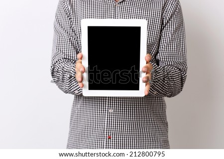Closeup portrait of a man showing tablet comptuter screen