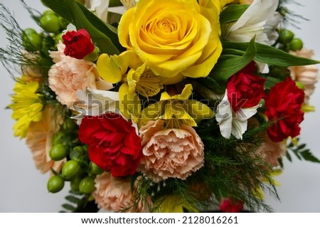 “They have no mouth, but seems to speak A thousand words so mild and meek” - Pearlyn. Flower arrangement gift in the late winter makes one yearn for spring. Royalty-Free Stock Photo #2128016261