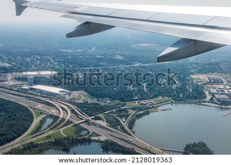 Plane aerial drone view of cityscape near Oxon Hill in Washington DC with i495 highway capital beltway outer loop with traffic cars and buildings