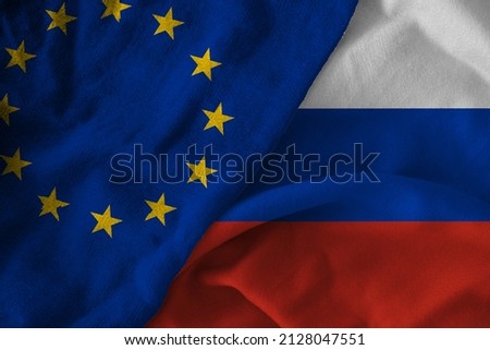 Concept of the relationship between Russia and the European Union with two flags over each other