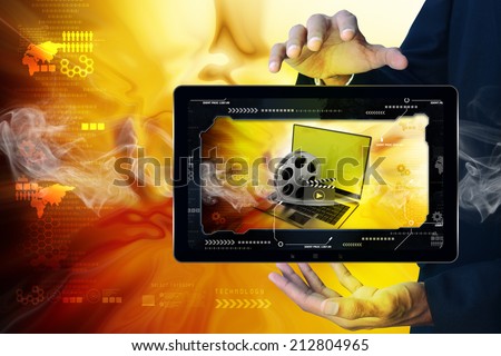 Smart hand showing Laptop with reel in frame
