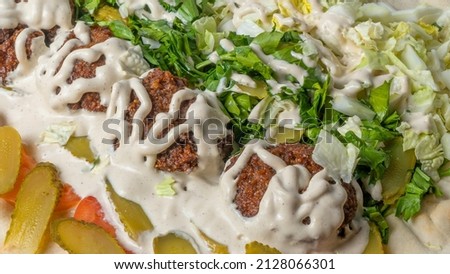 Close-up view of falafel and fresh salad. Vegan tacos. Vegetarian healthy food. Vegetarian falafel with salad on pita bread. Healthy food concepts.
