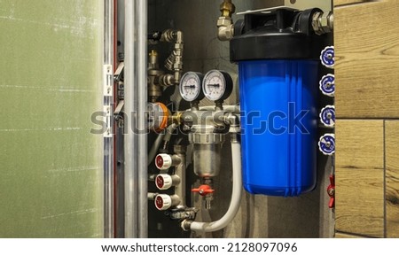 Home water filtration plant close-up. View through the open hatch Royalty-Free Stock Photo #2128097096