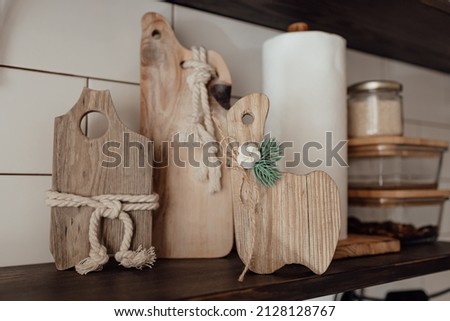 A cute rustic wooden toy in the kitchen. Kitchenware. Cozy way to rest, home comfort concept. 