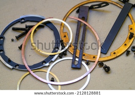 Clean and disassemble the lens for photography into its component parts Royalty-Free Stock Photo #2128128881