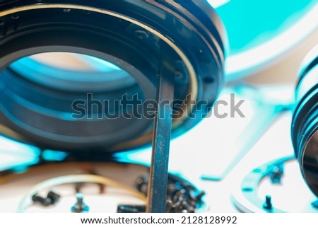 Clean and disassemble the lens for photography into its component parts Royalty-Free Stock Photo #2128128992