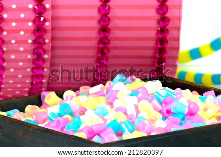 close Up of pixel beads, plastic granules or plastic beads on small clippers