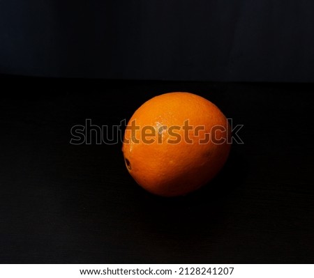 Yellow oranges on black background