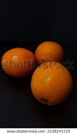 Yellow oranges on black background