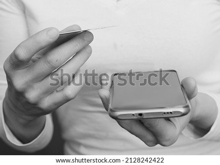 credit card purchasing woman shopping with a card with mobile phone with people stock photo 