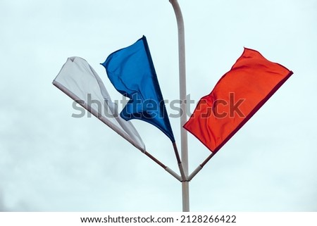 Russian flag on a white background. Flags of Russia flying in the wind. Red, white, blue flags. May 9 Victory Day
