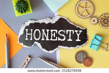 Honesty symbol. The concept word Honesty on wooden circles. Beautiful white background, copy space. Business and honesty concept.