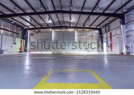 A airplane Hangar on a abandoned military airfield  Royalty-Free Stock Photo #2128310660
