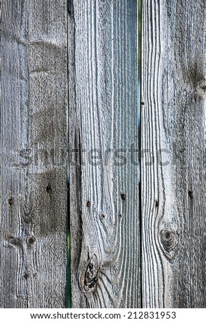 old wooden fence with barbed wire on top