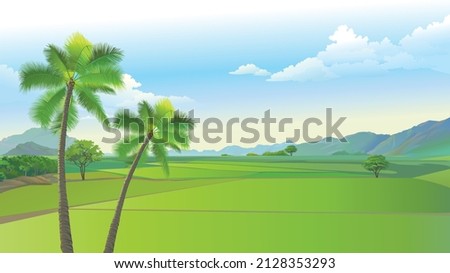 Indian village farming area large green cultivation land rural India agricultural land with coconut tree and mountain. green crops Royalty-Free Stock Photo #2128353293