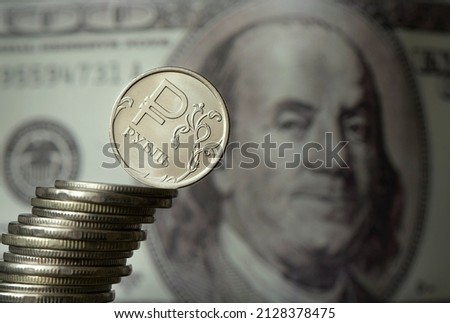 dollars and rubles. concept of currency exchange. Economic crisis, decline of the world economy. Ruble devaluation. The fall of the Russian currency. Currency exchange at the Bank. sharp drop ruble's Royalty-Free Stock Photo #2128378475