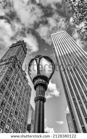Street lamp post and skyscrapers in New York City; upward view; USA.
