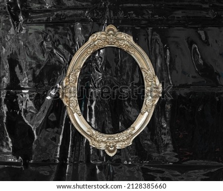 vintage golden oval frame on black background