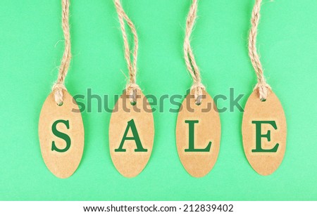Sale tags on green background