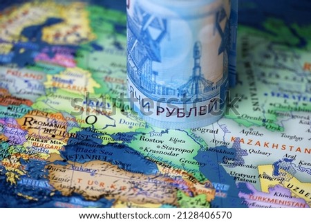 Russian rubles on map of Ukraine and Russia. Concept of russian support of Donbass Royalty-Free Stock Photo #2128406570