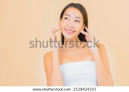 Portrait beautiful young asian woman with beauty spa cosmetic makeup concept on color isolated background