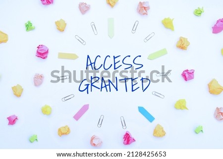 Text caption presenting Access Granted. Business overview admittance of users to system and network resources Multiple Assorted Collection Office Stationery Photo Placed Over Table