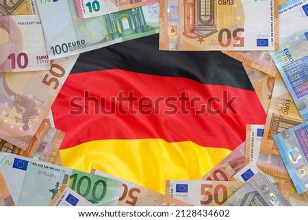 Macup of Euro banknotes on the flag of Germany background. Different Euro banknotes frame. Business, finance, investment, saving and corruption concept of Europe Royalty-Free Stock Photo #2128434602