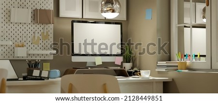 Modern contemporary office workspace studio with pc desktop computer white screen mockup, decorations and office supplies. 3d rendering, 3d illustration