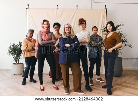 International Women's Day portrait of multi ethnic mixed age range women looking confidently towards camera, Embrace Equity Royalty-Free Stock Photo #2128464002