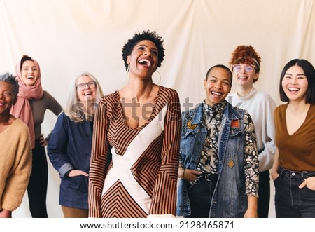 International Women's Day portrait of cheerful multi ethnic mixed age range women laughing and smiling Royalty-Free Stock Photo #2128465871