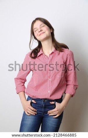 Modern teen girl posing on camera as a fashion model