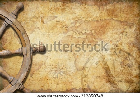 aged treasure map with steering wheel