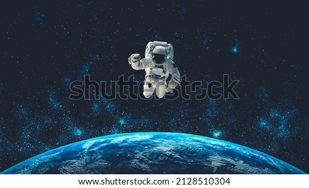 Astronaut spaceman do spacewalk while working for spaceflight mission at space station . Astronaut wear full spacesuit for operation . Elements of this image furnished by NASA space astronaut photos . Royalty-Free Stock Photo #2128510304
