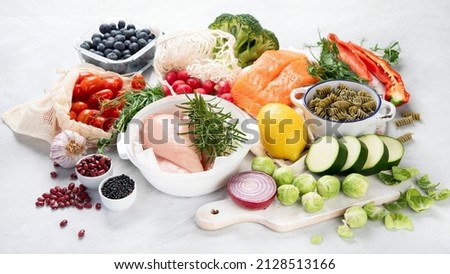 Healthy food assortment on light background. Clean eating concept.  Royalty-Free Stock Photo #2128513166