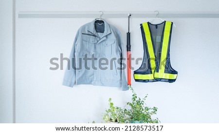 Work clothes hung on the wall.Construction industry image.