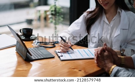 Female health insurance broker presenting his insurance benefits to businessman fill out insurance policy. To prevent future incidents.