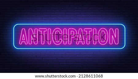 Neon sign Anticipation on brick wall background. Royalty-Free Stock Photo #2128611068