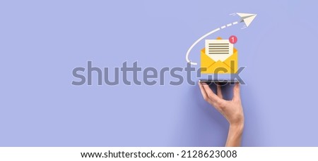 Businessman hand holding letter icon,email icons.Contact us by newsletter email and protect your personal information from spam mail.Customer service call center contact us.Email marketing newsletter Royalty-Free Stock Photo #2128623008