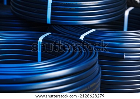 Set of black electric cable reels close up Royalty-Free Stock Photo #2128628279