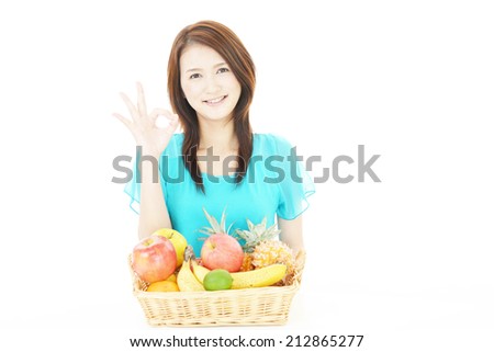 Smiling woman with fruits