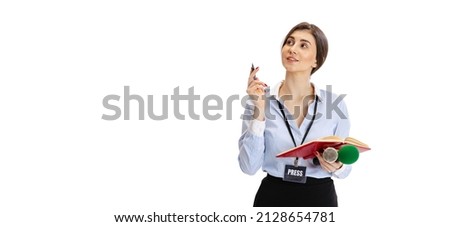 Ideas. Young beautiful girl, female journalist holding reporter microphone isolated on white studio background. Concept of social media, press, news, information, advertising. Emotional woman at work
