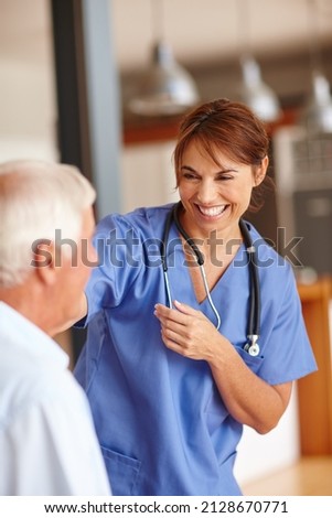 Shes got an excellent bedside manner. Cropped shot of a female nurse checking on her senior patient.