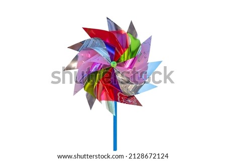 Colorful paper spinner or colorful windmill isolated on white background with clipping path. Kids toys, celebration party concept.