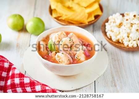 Ecuadorian shrimp ceviche, a traditional appetizer. On a white wooden table.  Royalty-Free Stock Photo #2128758167