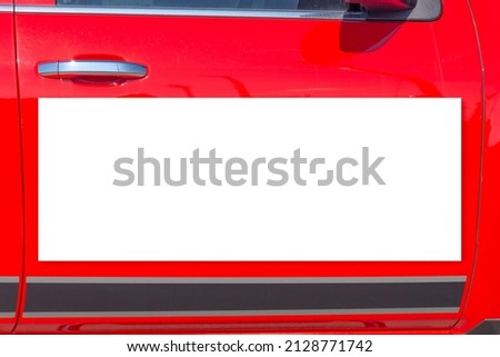 Horizontal shot of a blank white magnetic sign on a red pickup truck door with copyspace.