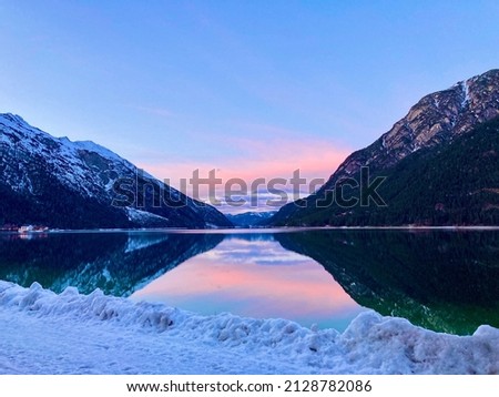 Lake Achen in Austria at dusk in Winter Royalty-Free Stock Photo #2128782086